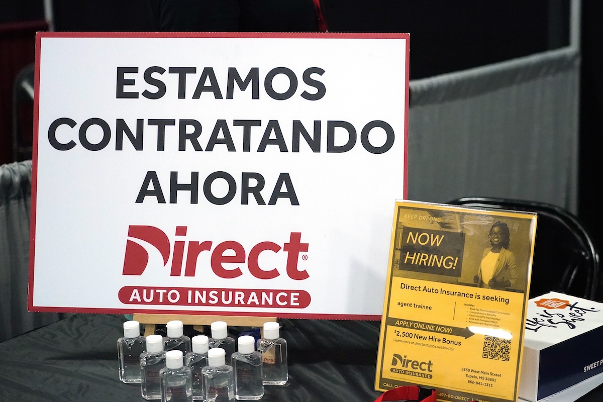 Hispanic worker hiring sign