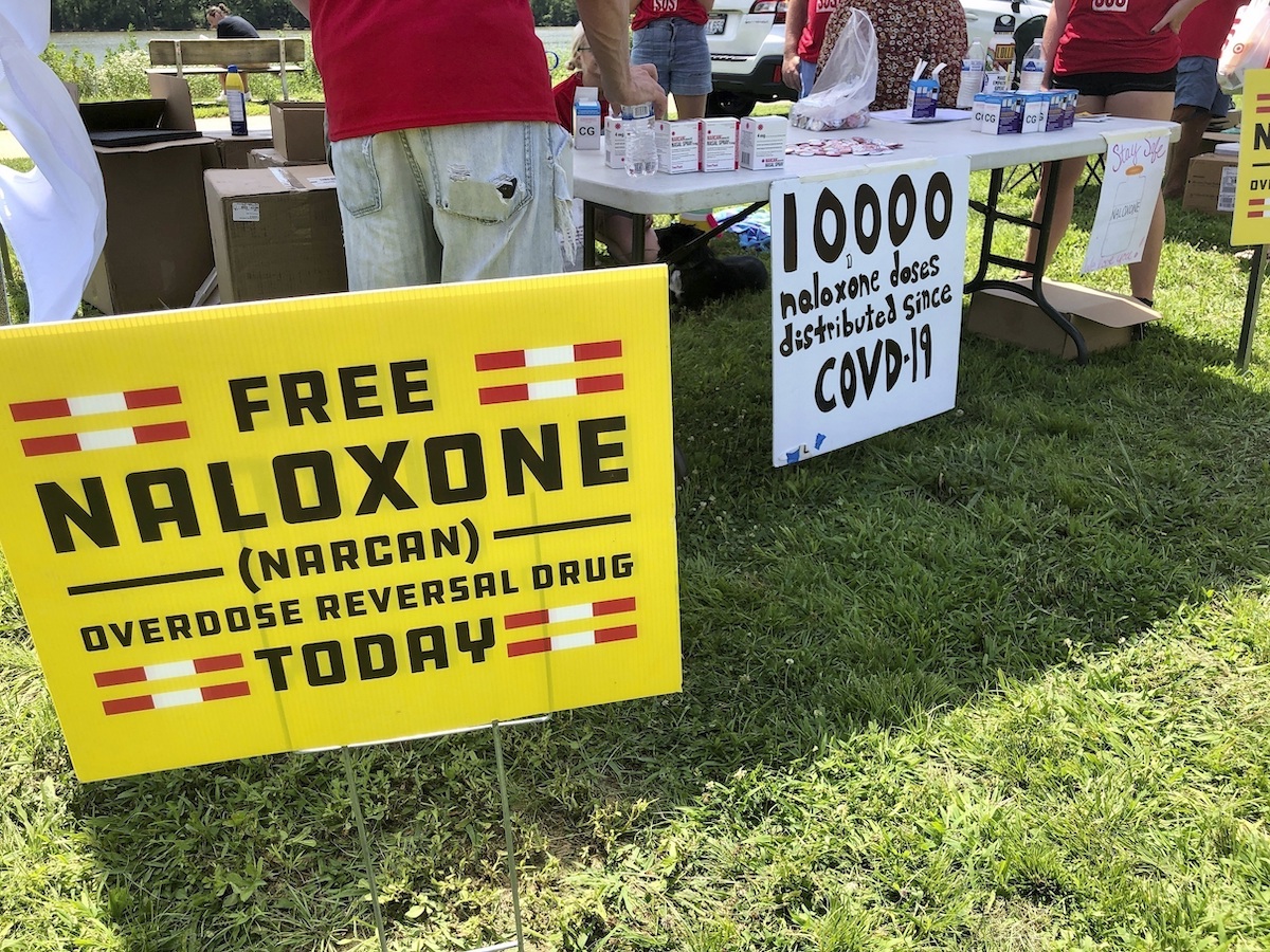 Signs are displayed at a tent during a health event on June 26, 2021, in Charleston, W.Va. (AP)