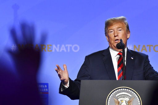 Trump points at NATO press conference belgium
