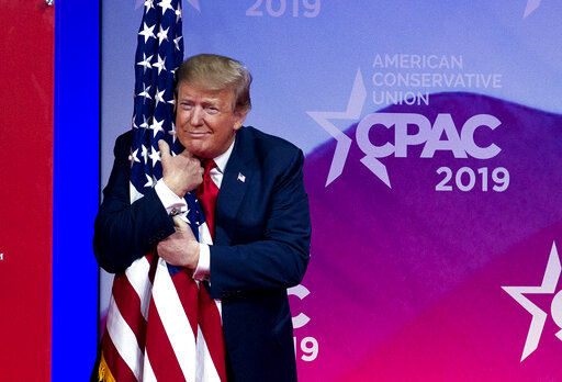 Trump hugs flag