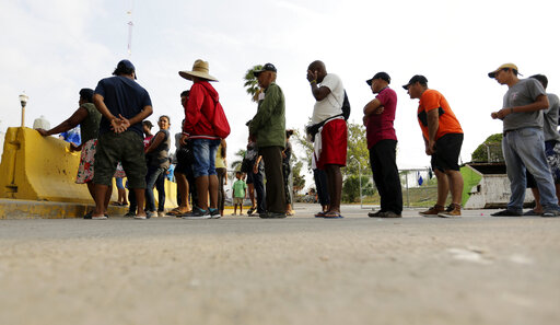 Migrants lining up