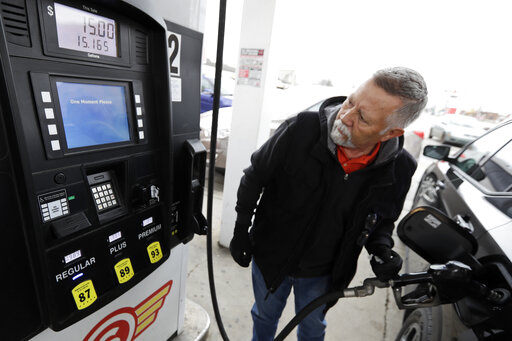 Man pumping gas