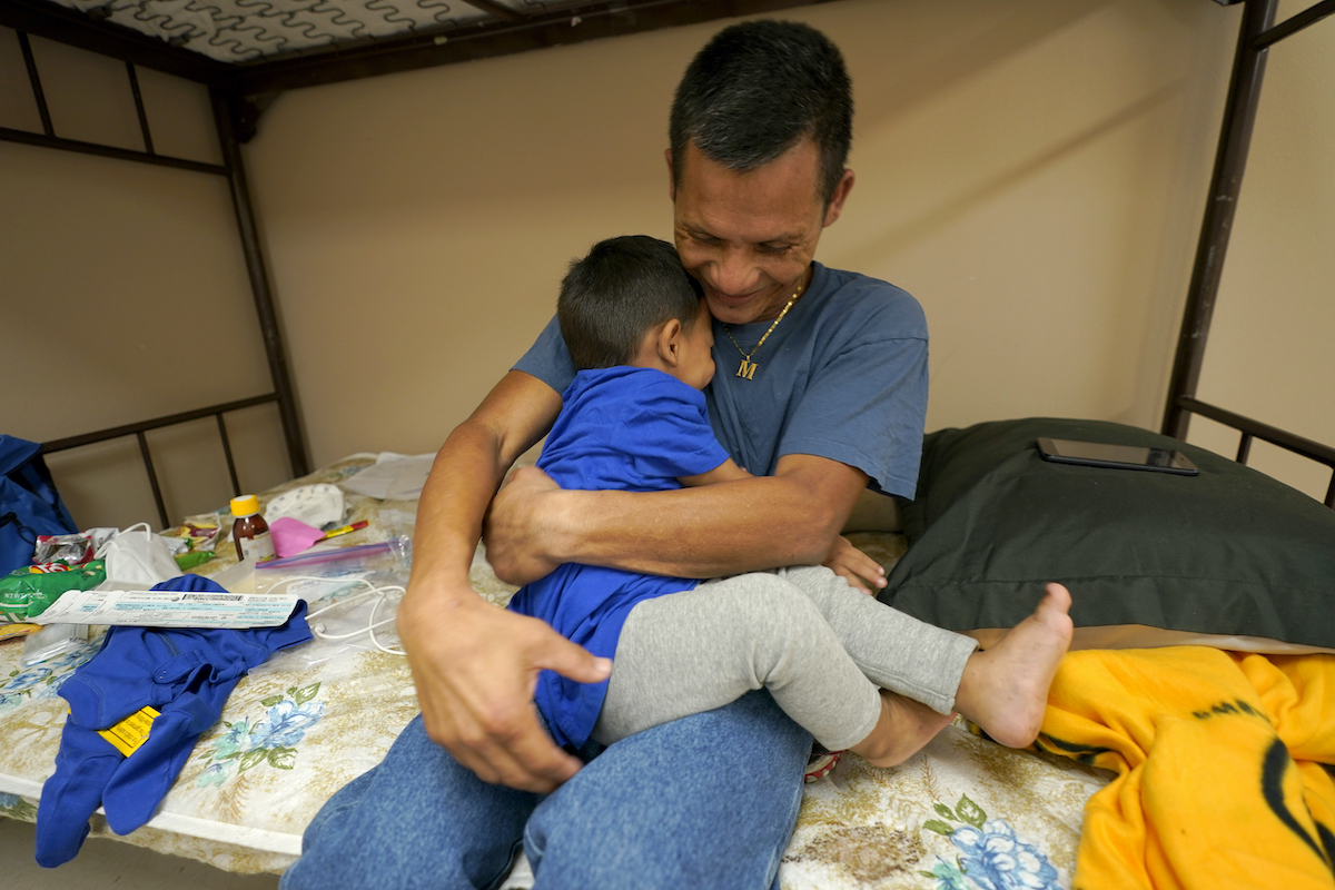 migrant father and child march 22 2021