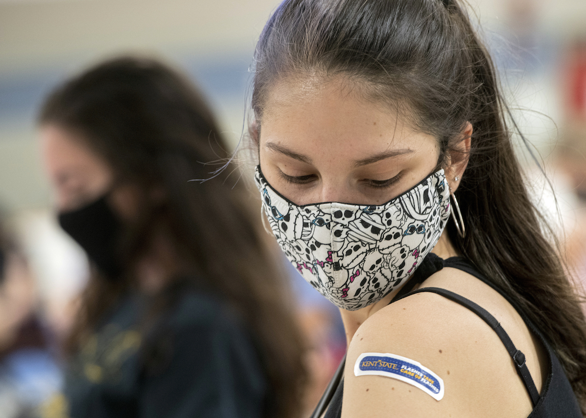 College girl covid vaccine bandaid on shoulder art