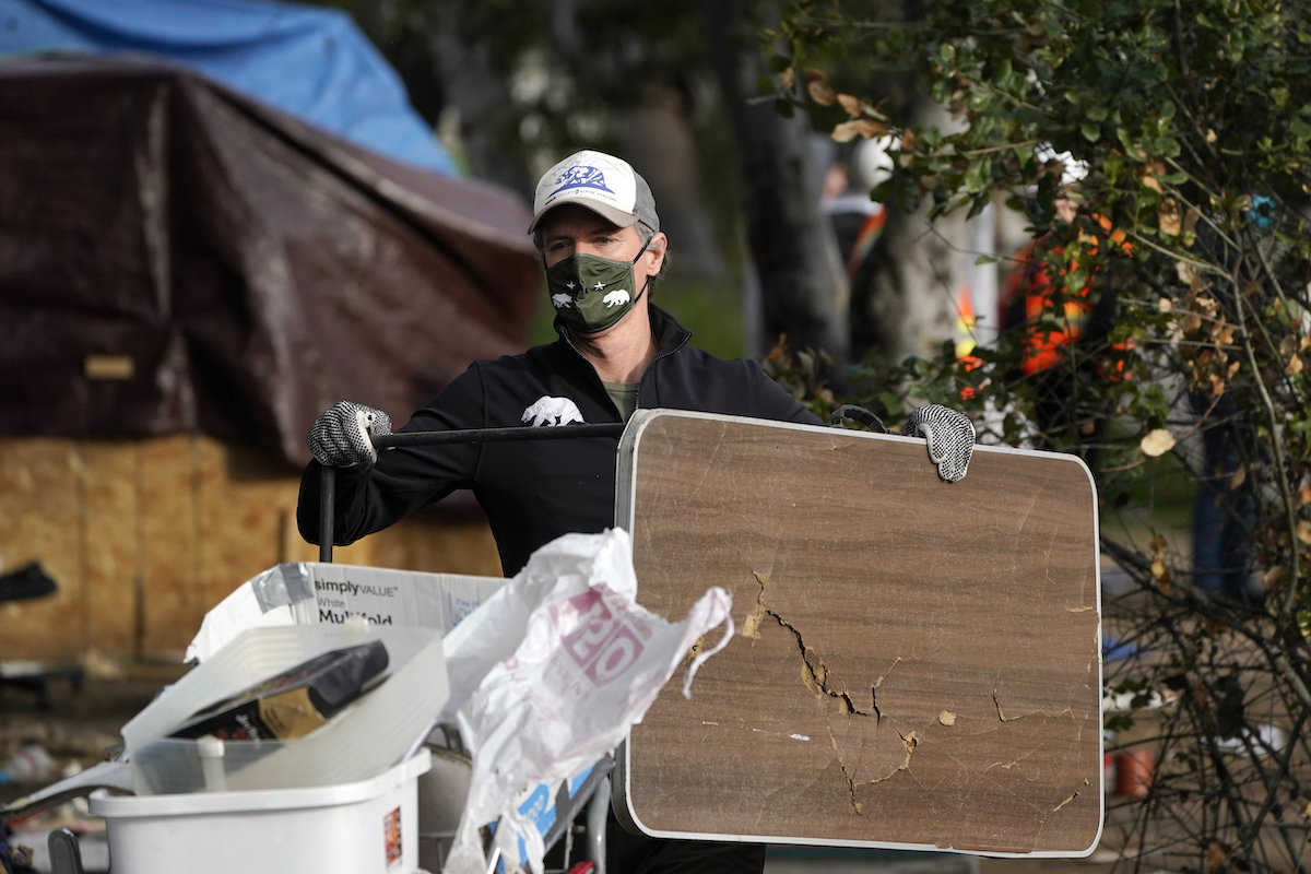 Gavin Newsom January 2022 homeless encampment cleanup art