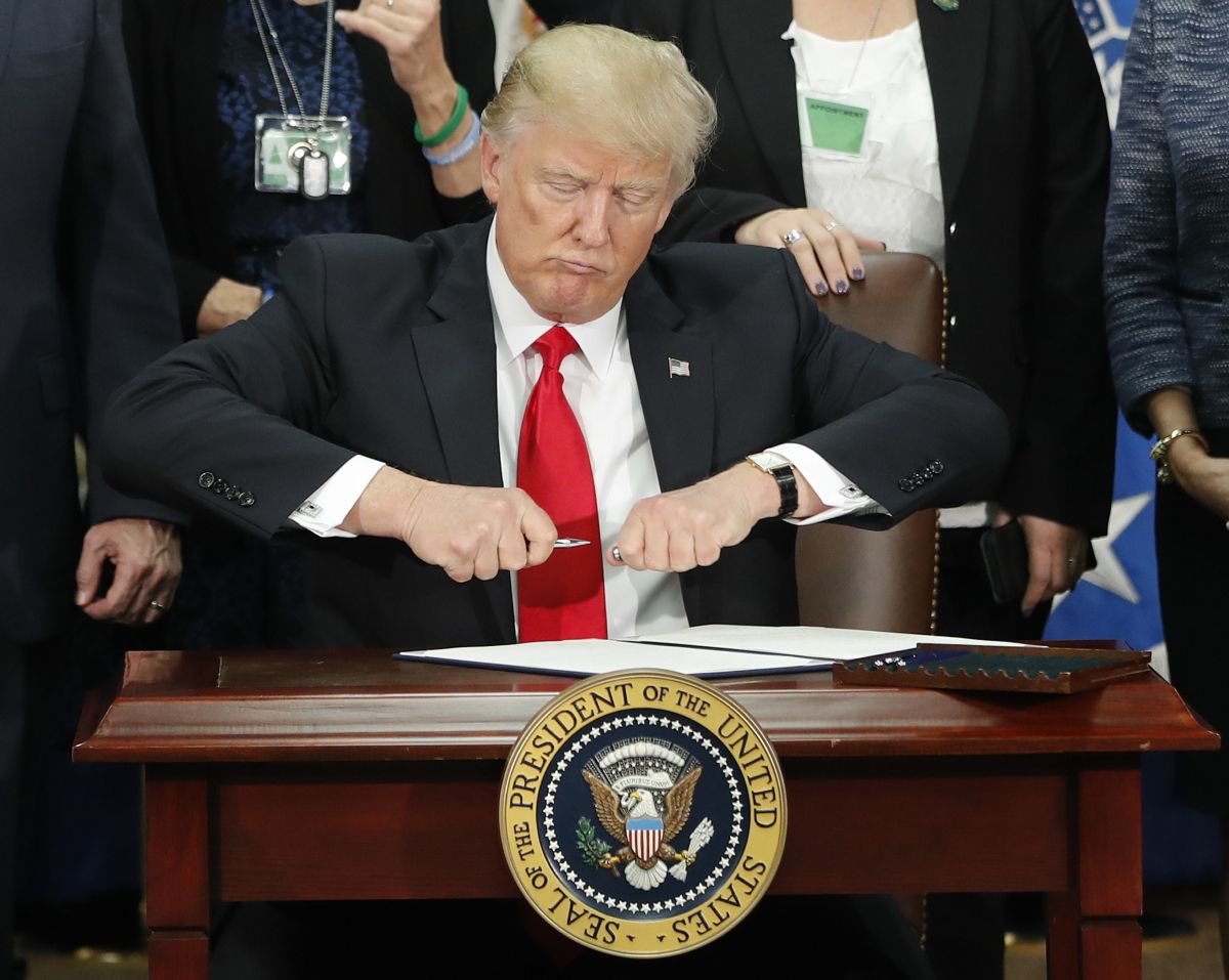 Donald Trump right before he's about to sign an immigration order