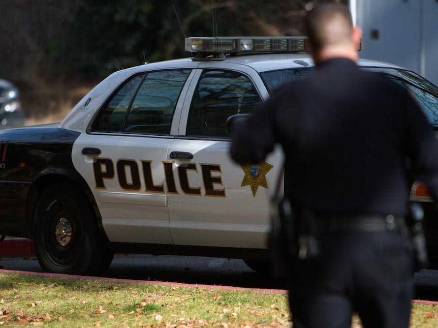 Cop and police car