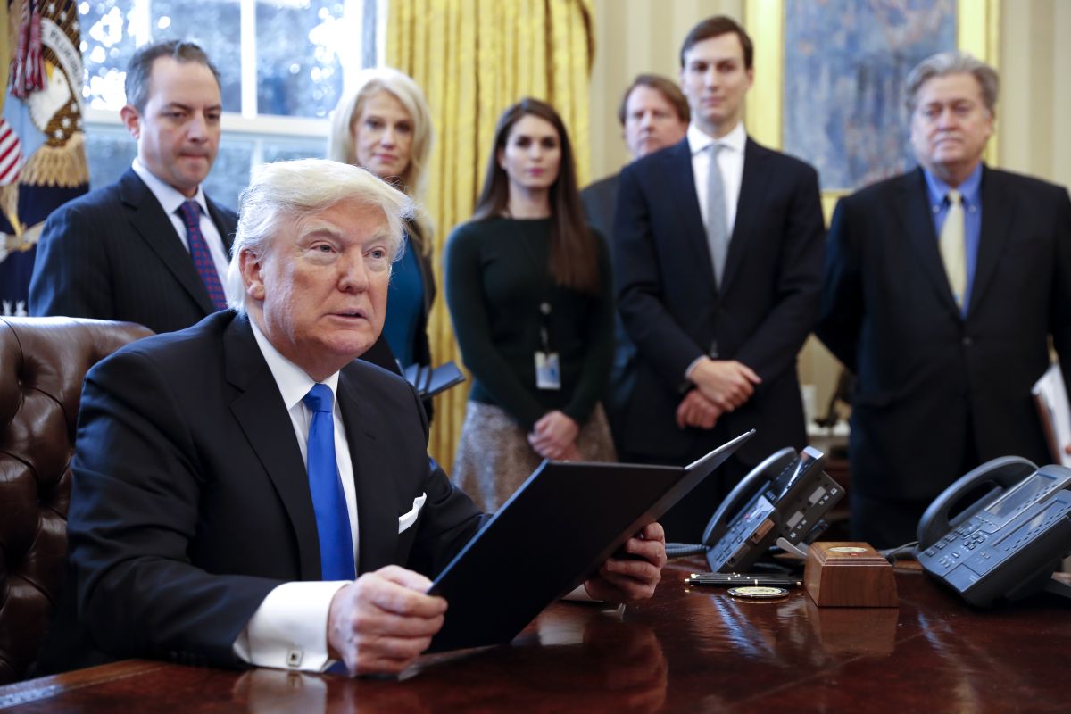 Trump signing EOs on Jan. 24