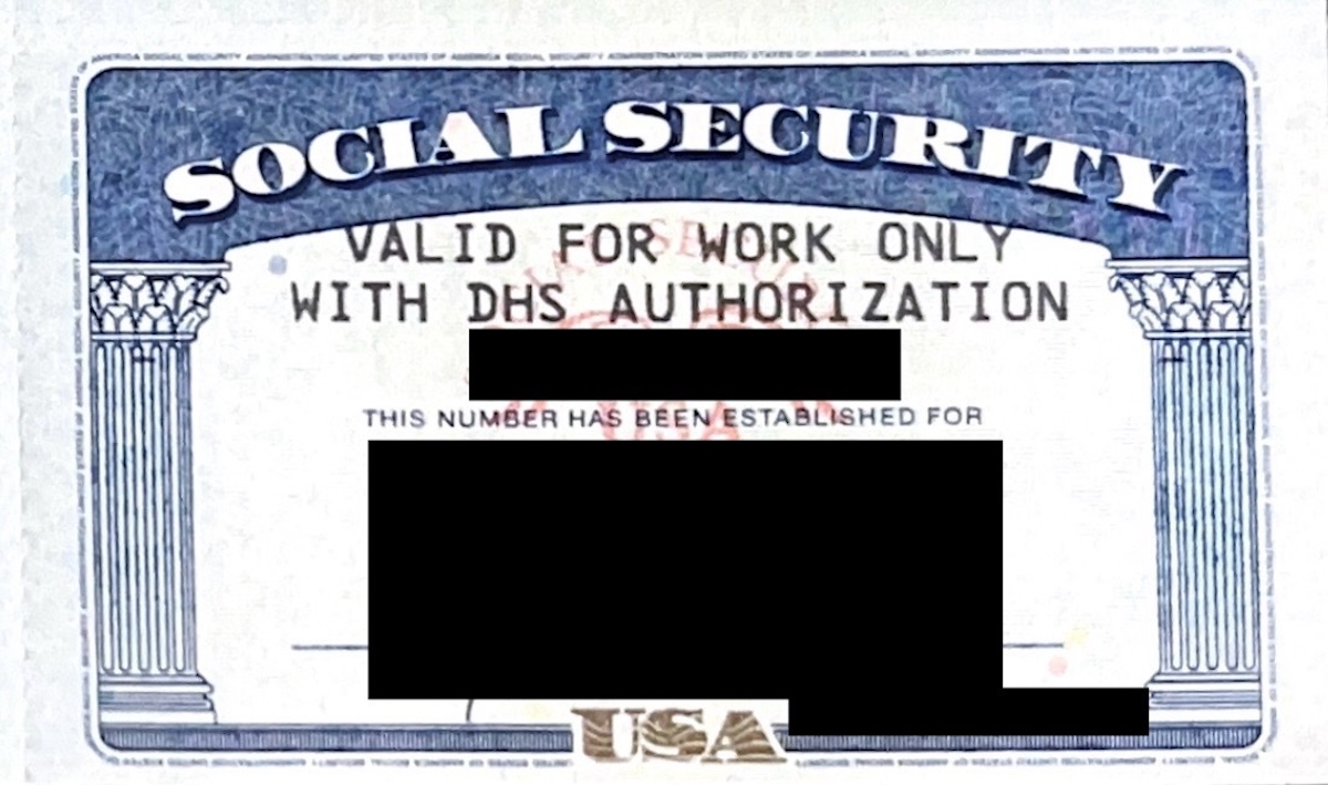 Photo of a Social Security card for noncitizens with temporary work permits.