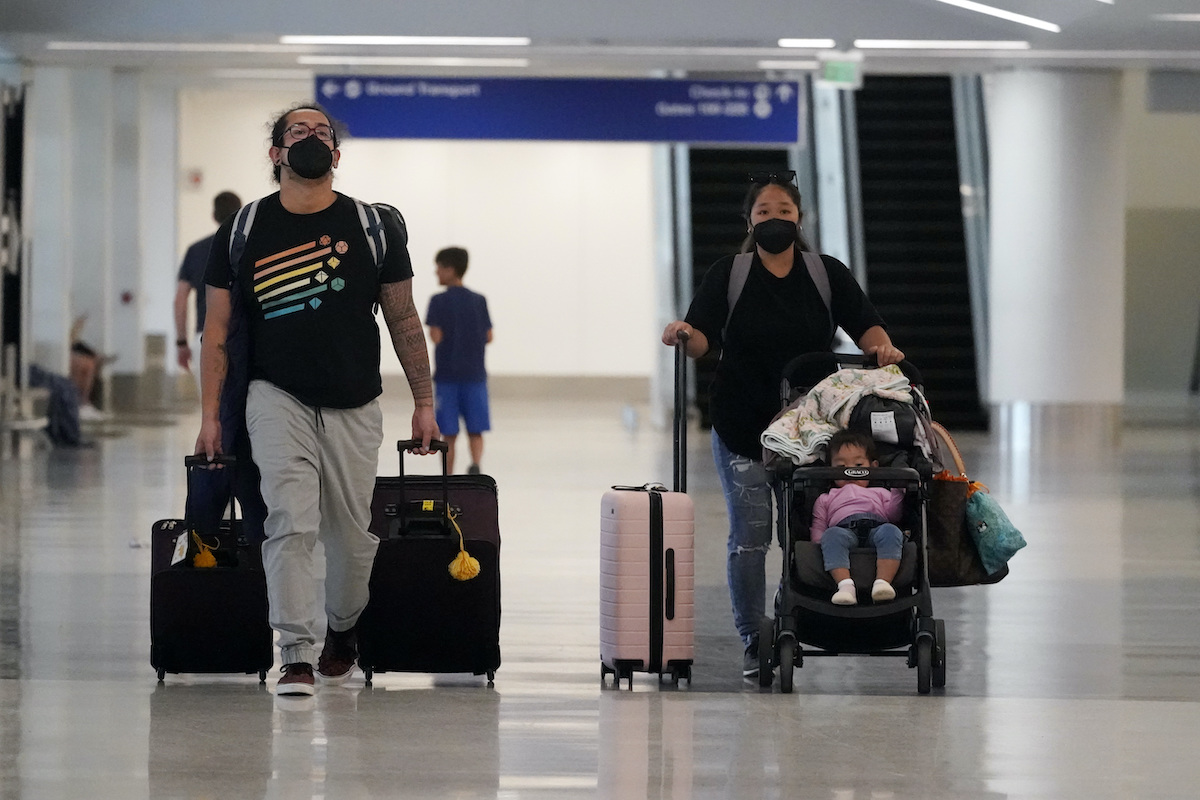 Masked travelers in the airport