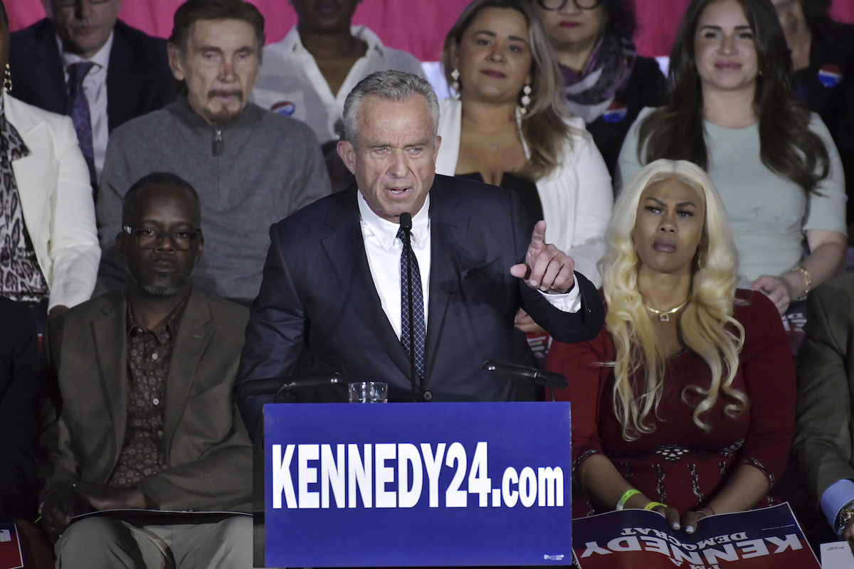 RFK Jr speaks at podium, announcing presidential run