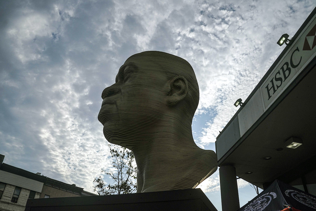 The refurbished George Floyd statue in Brooklyn is unveiled after it was vandalized following its Juneteenth installation, Thursday, July 22, 2021 (AP Photo/Bebeto Matthews)