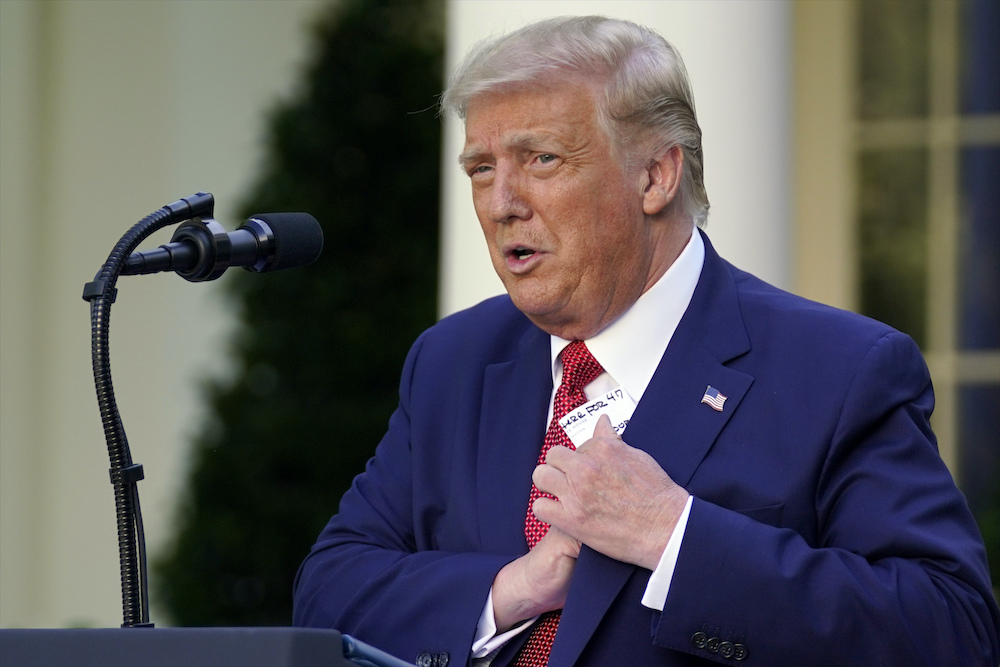 Trump July 14 reaching for paper