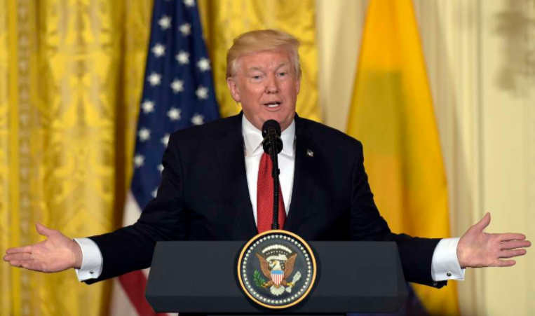 Trump arms wide