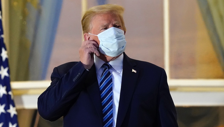 Trump removes mask
