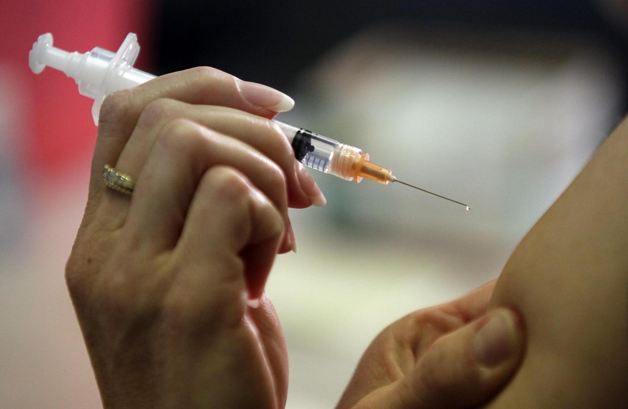 AP file photo of an arm receiving a vaccine