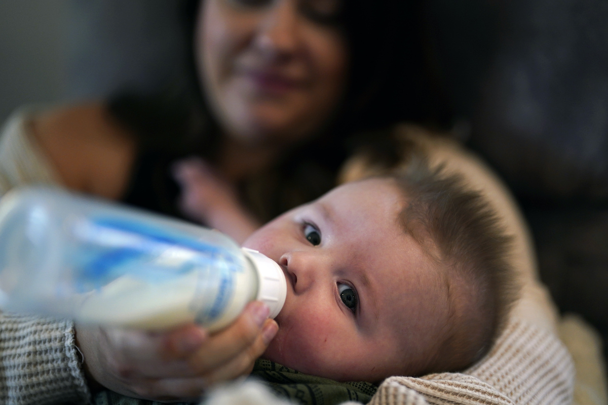 baby drinking from bottle