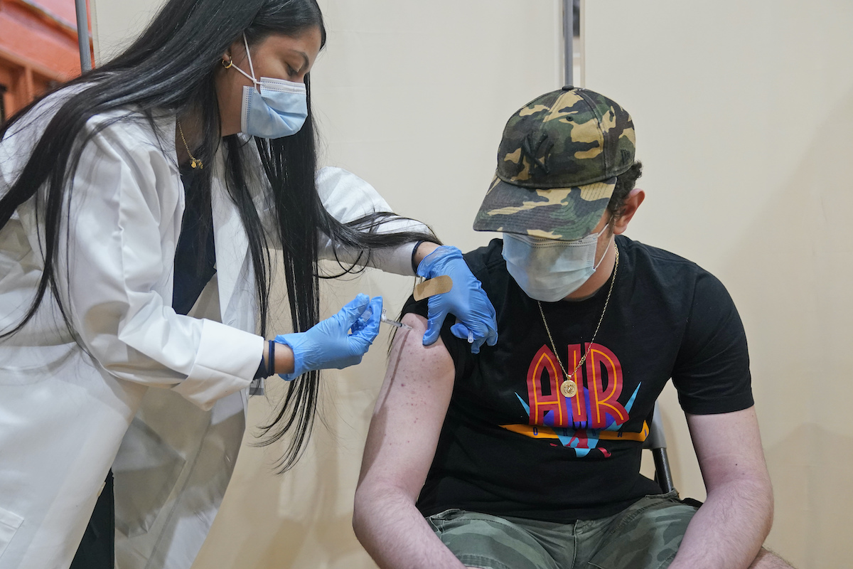 Teenage boy receives Pfizer vaccine