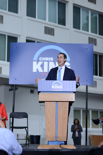 Chris King at a podium
