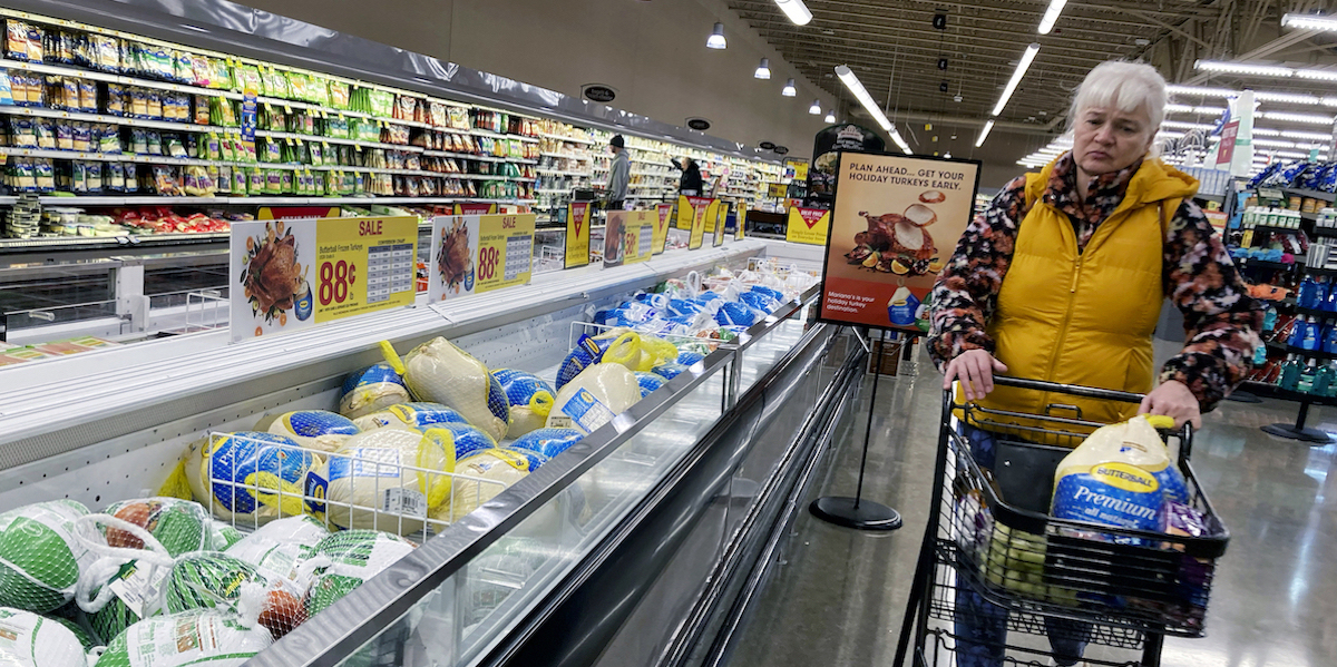 Woman shopping for turkeys in 2022