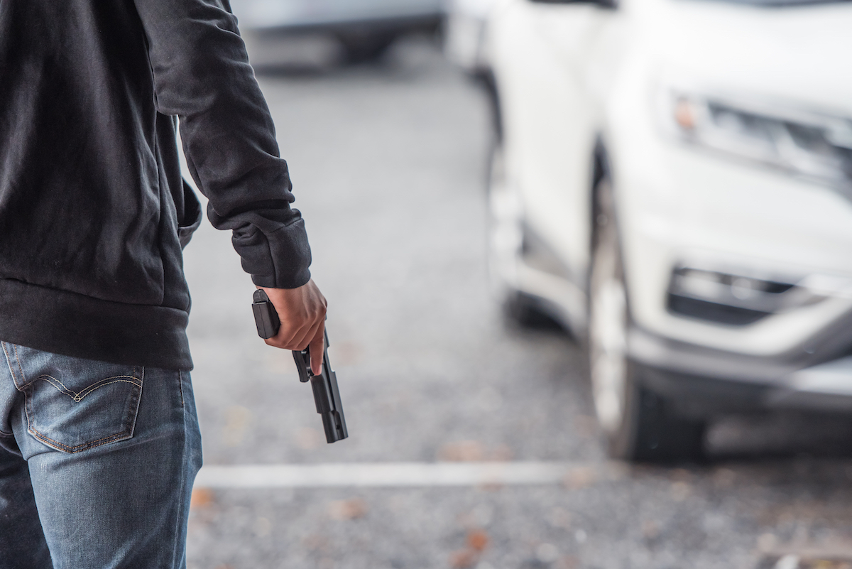 Man handgun parking lot