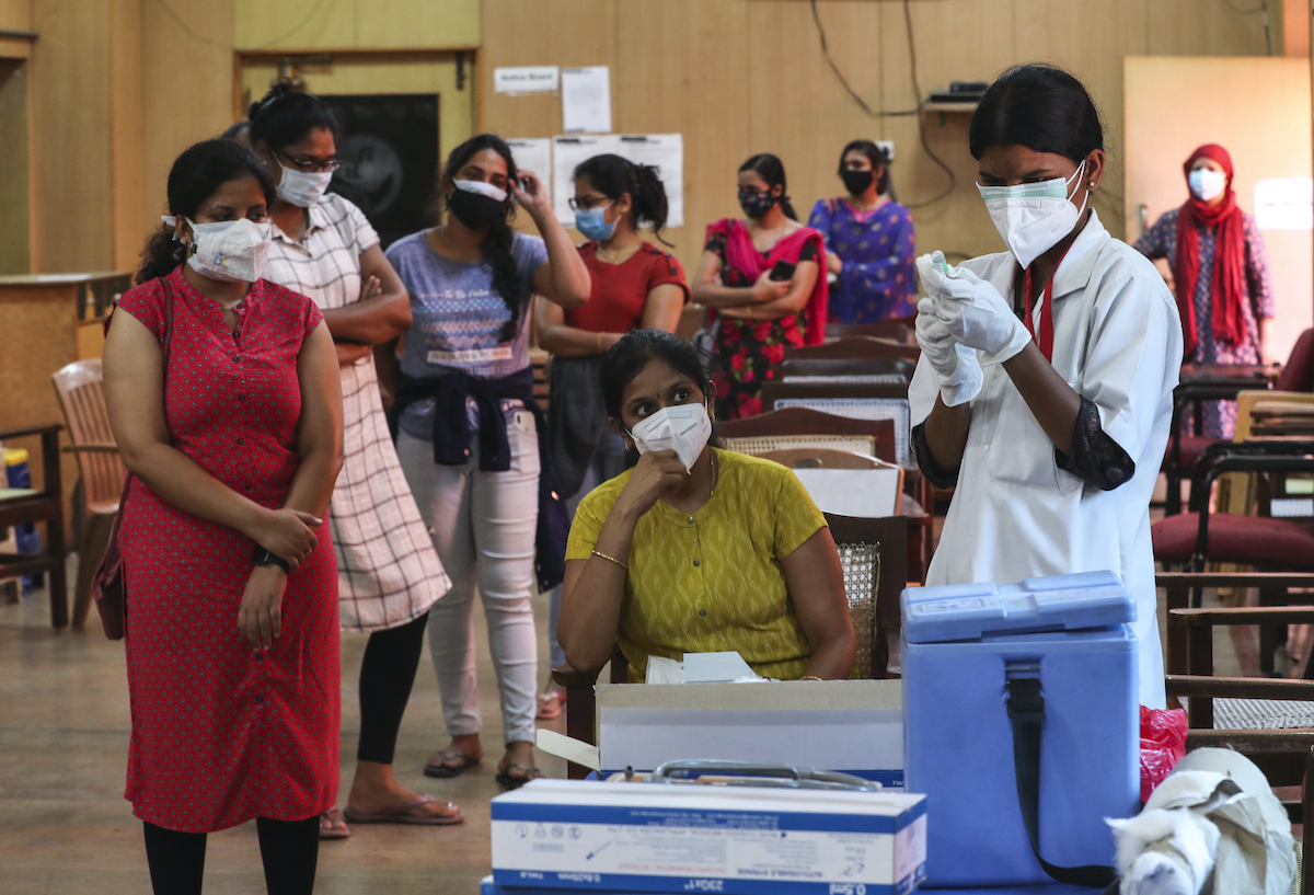 India COVID-19 vaccination nurse 05 21 21