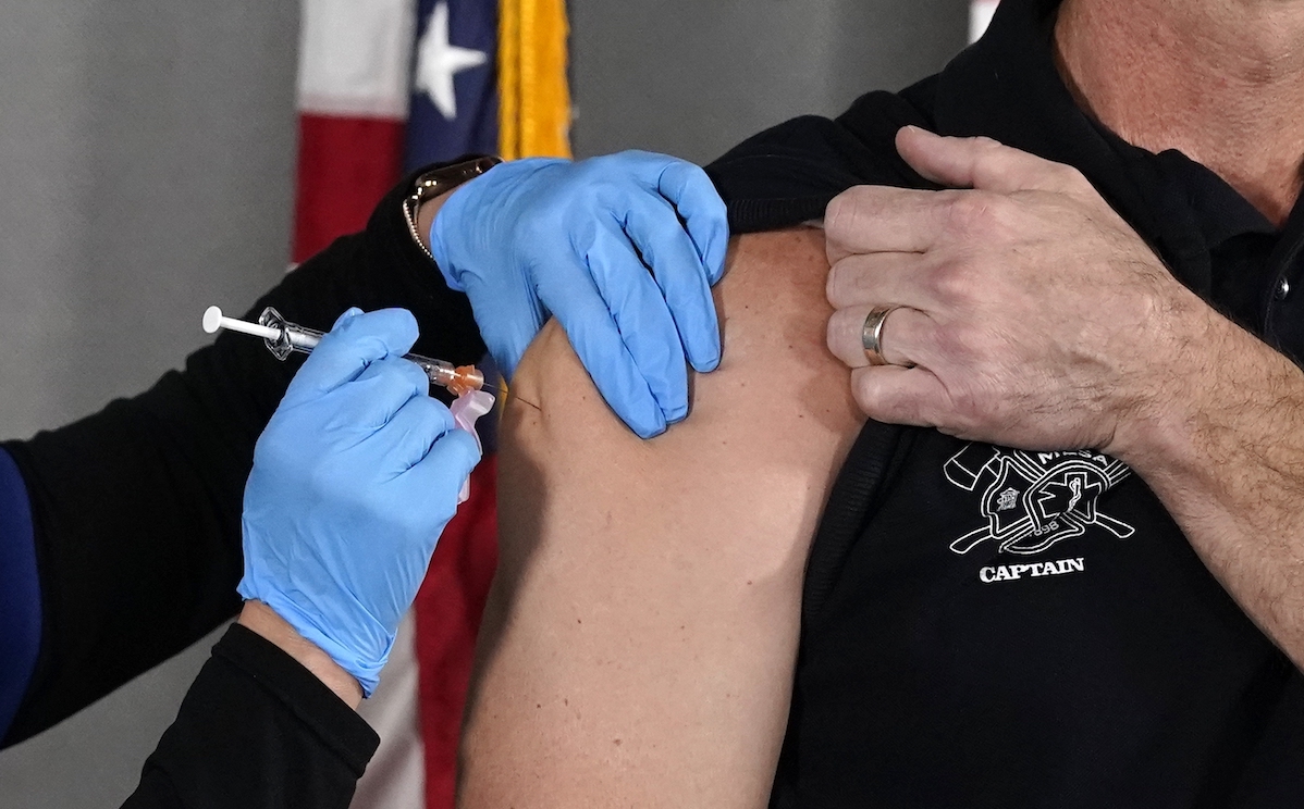 man gets vaccinated