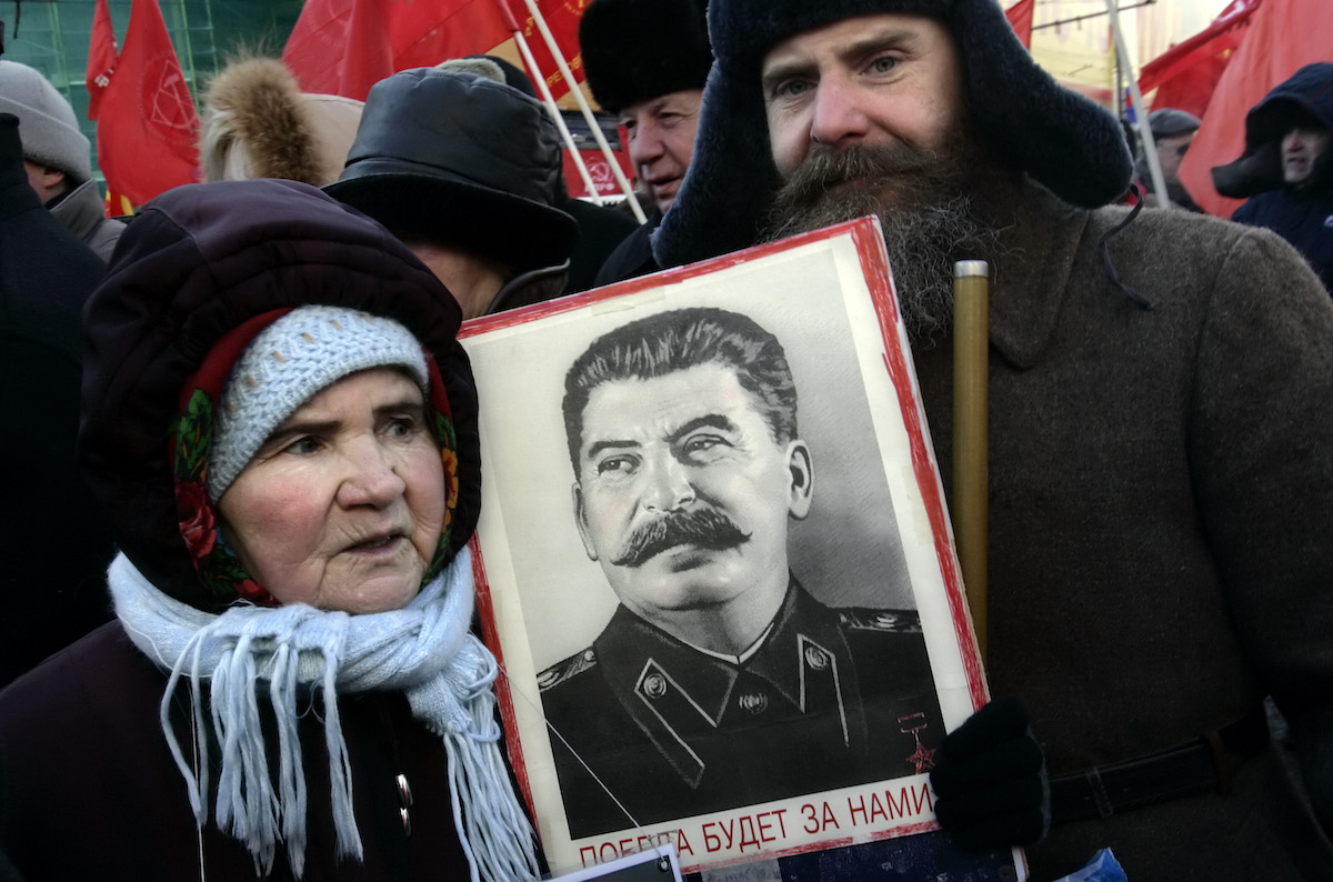 People carrying portrait of Joseph Stalin