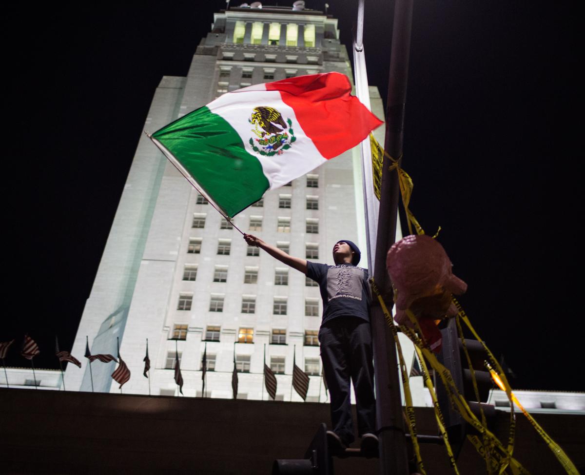 Man holding Mexican flag