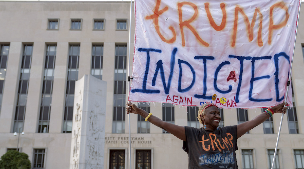 Protester outside DC courthouse, 8-1-2023