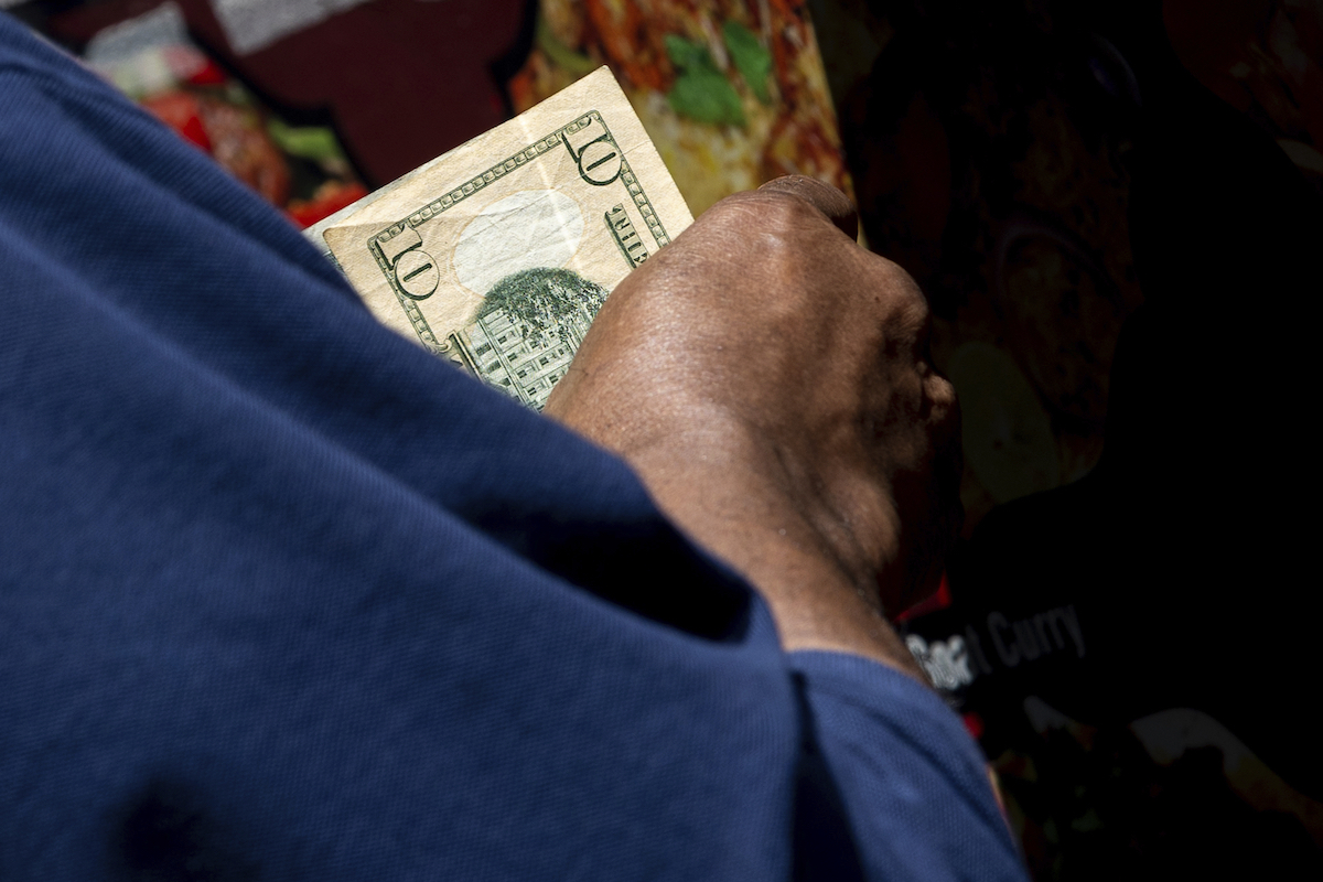 $10 bill being used, July 13, 2022