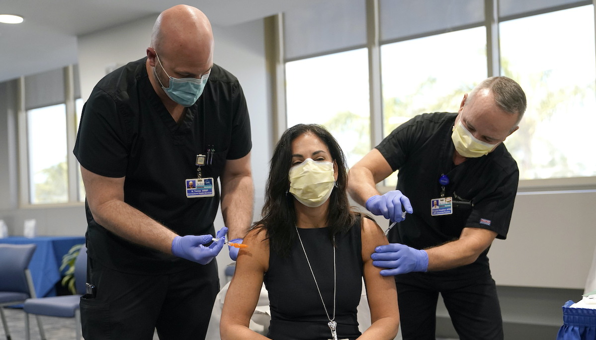 Doctor receives flu and COVID-19 booster vaccines