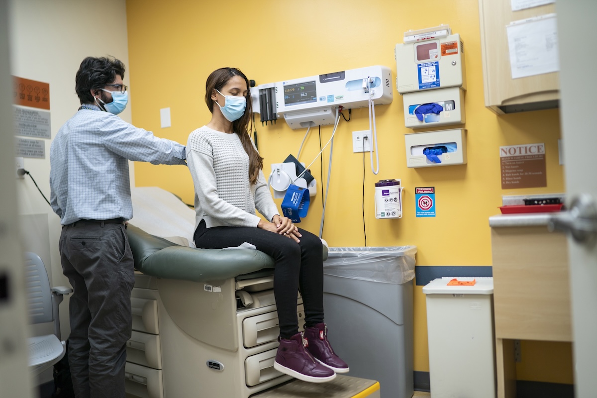 Doctor checking patient at Queens health clinic 2024