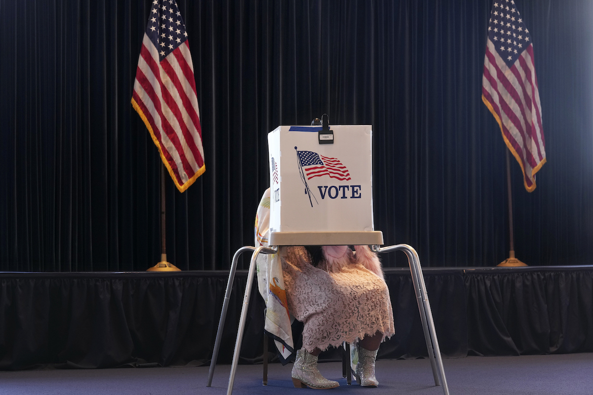 Woman voting in presidential elections 2024