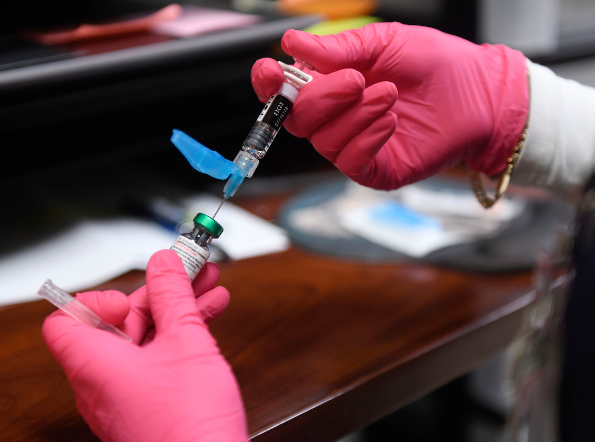 hands holding MMR vaccine April 8, 2025 Texas