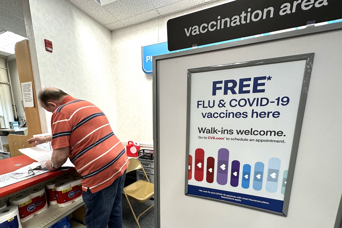 Flu and COVID vaccine sign in Sept. 13 2023