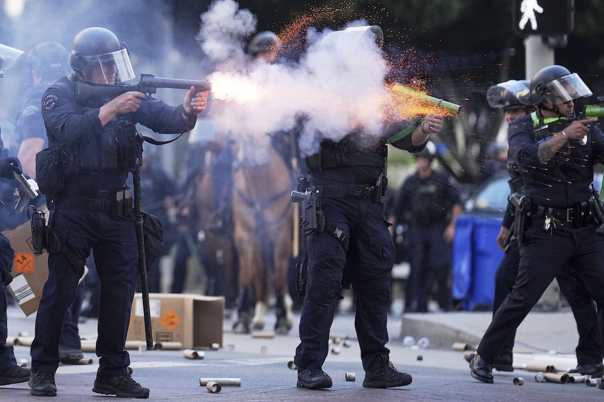 Police officer firing soft round LA 6-8-25