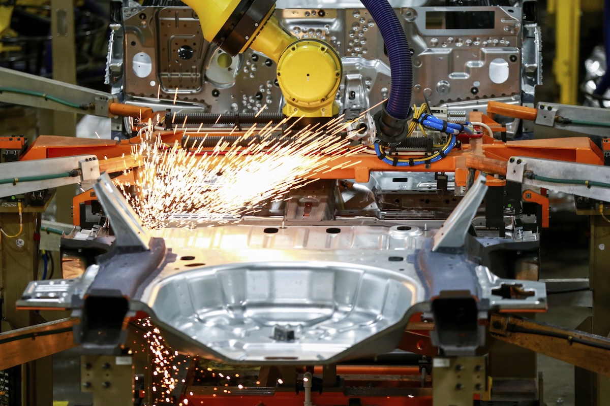 Factory assembly line with sparks flying