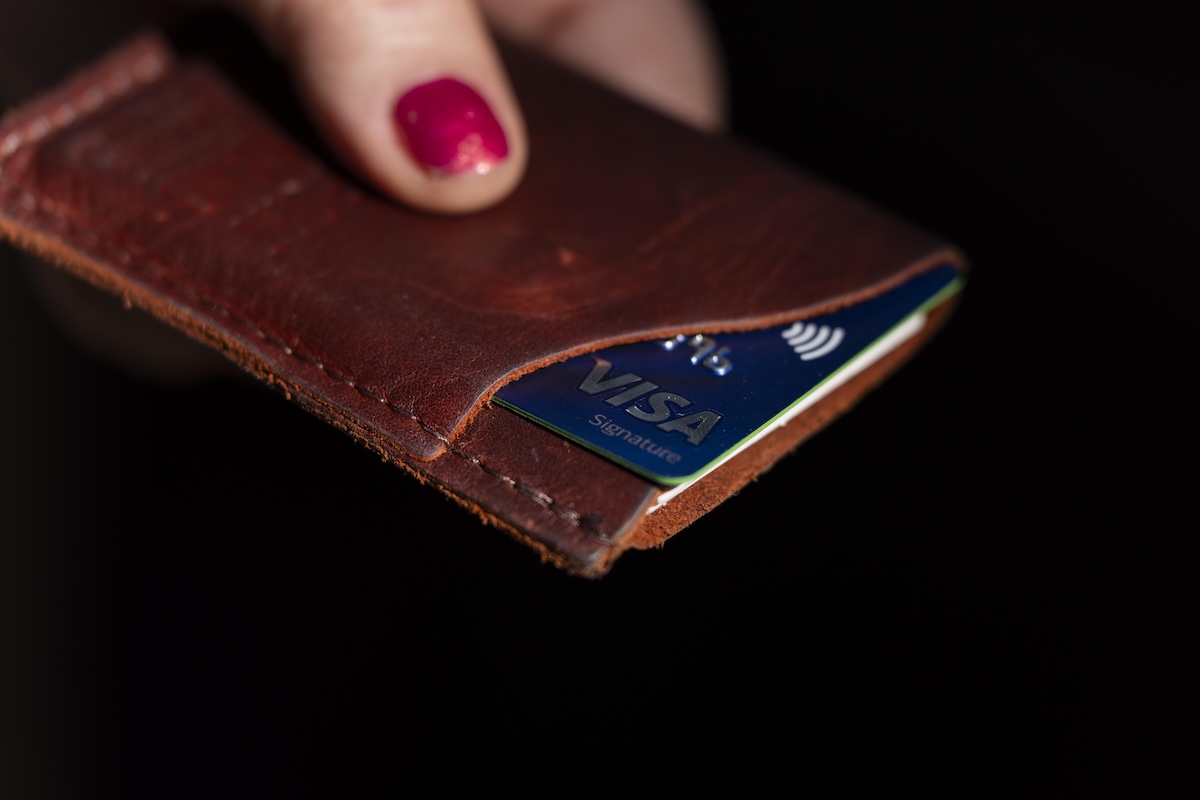Woman's hand holding credit card