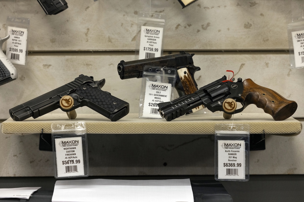 Pistols for sale sitting on shelf