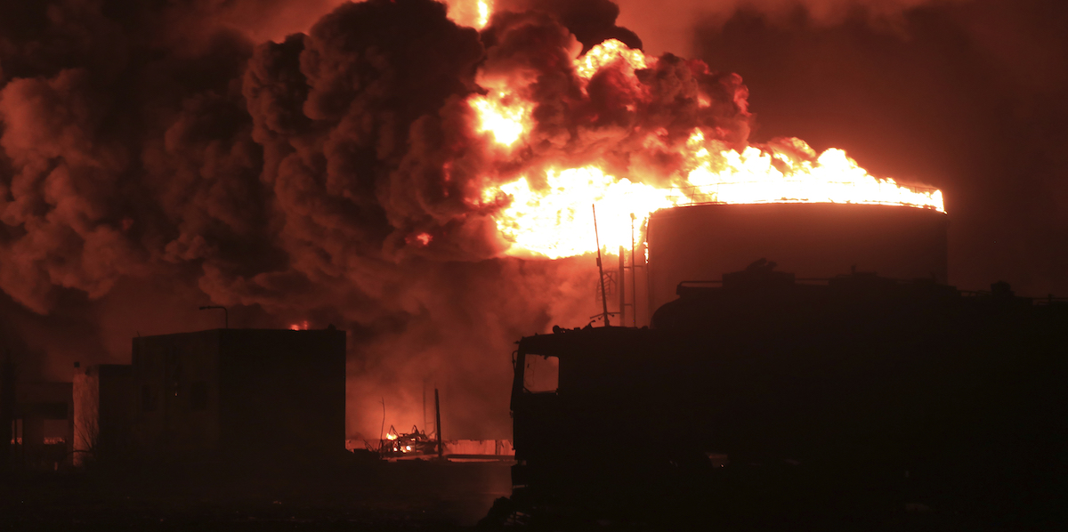 Oil tanks burn at the port in Hodeidah, Yemen