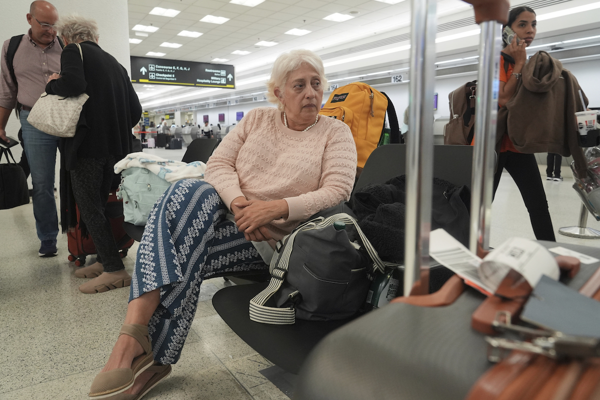 Woman in airport flying to Venezuela after Trump annouced travel ban