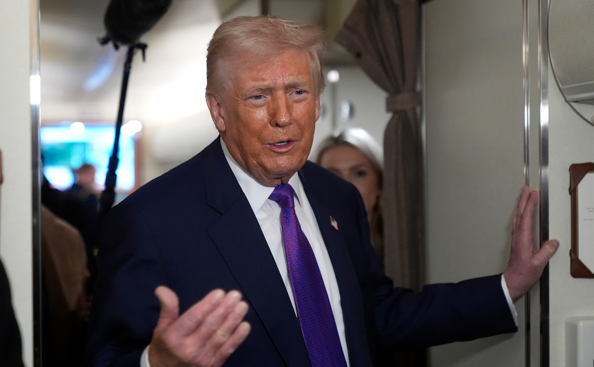 Trump speaks to reporters on Air Force One 02-19-26