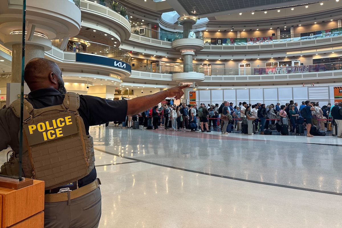 ICE agent at airport during DHS partial shutdown 03-23-26