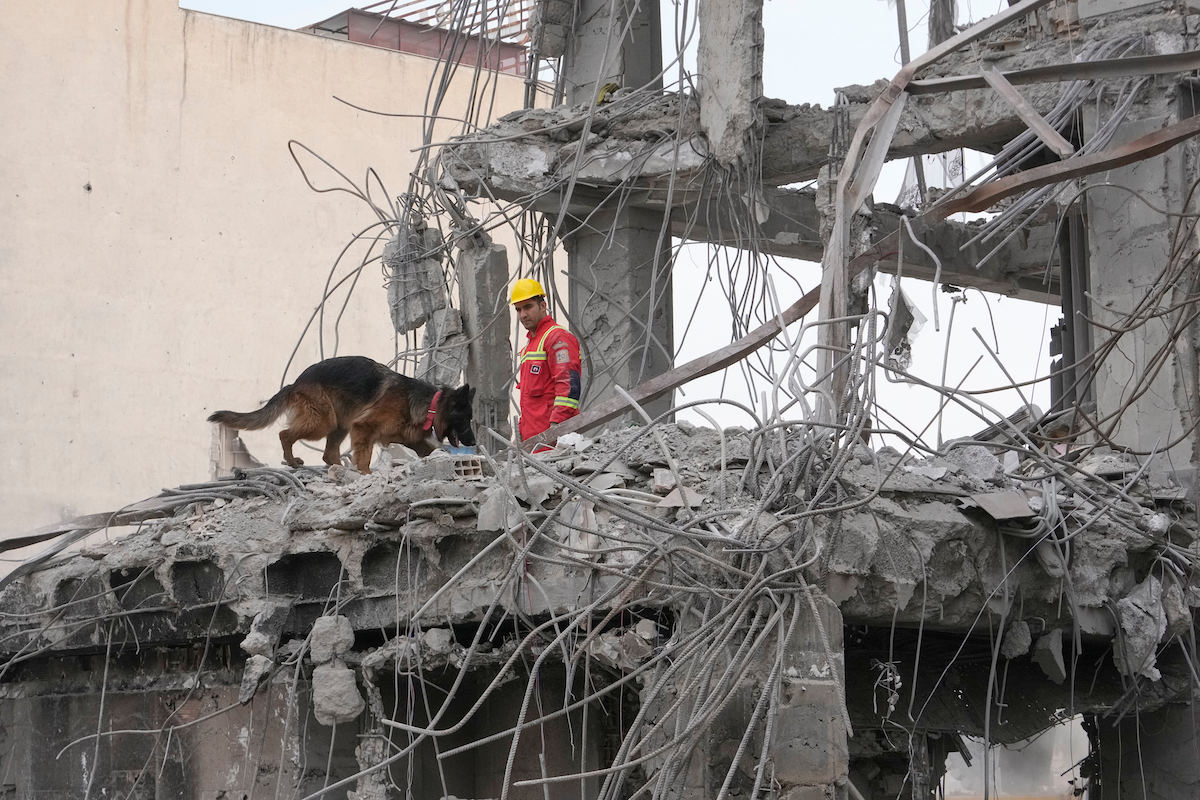 Iran rescue worker rubble 3-12-26