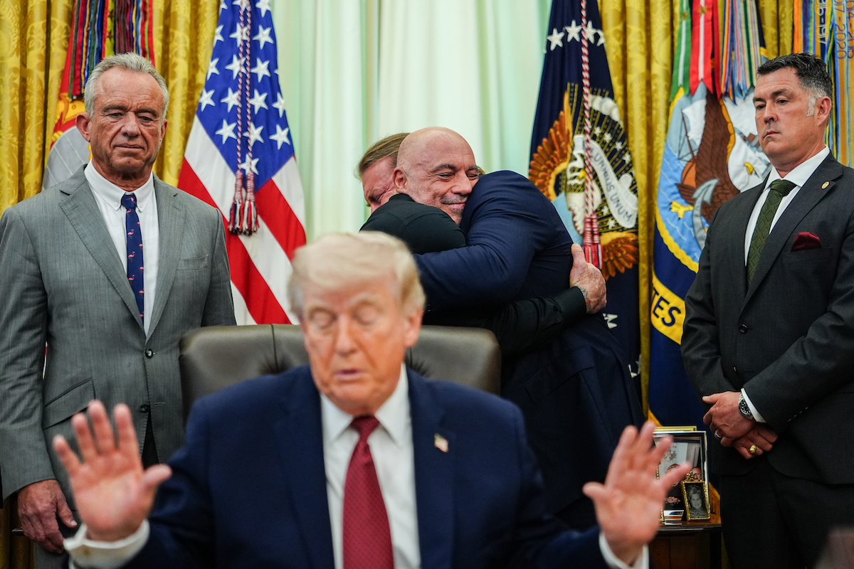 Rogan hugs Americans for Ibogaine CEO at EO signing April 18, 2026