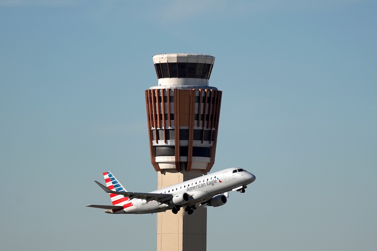 American Airlines jet past air traffic control tower, Phoenix, 11-08-2025