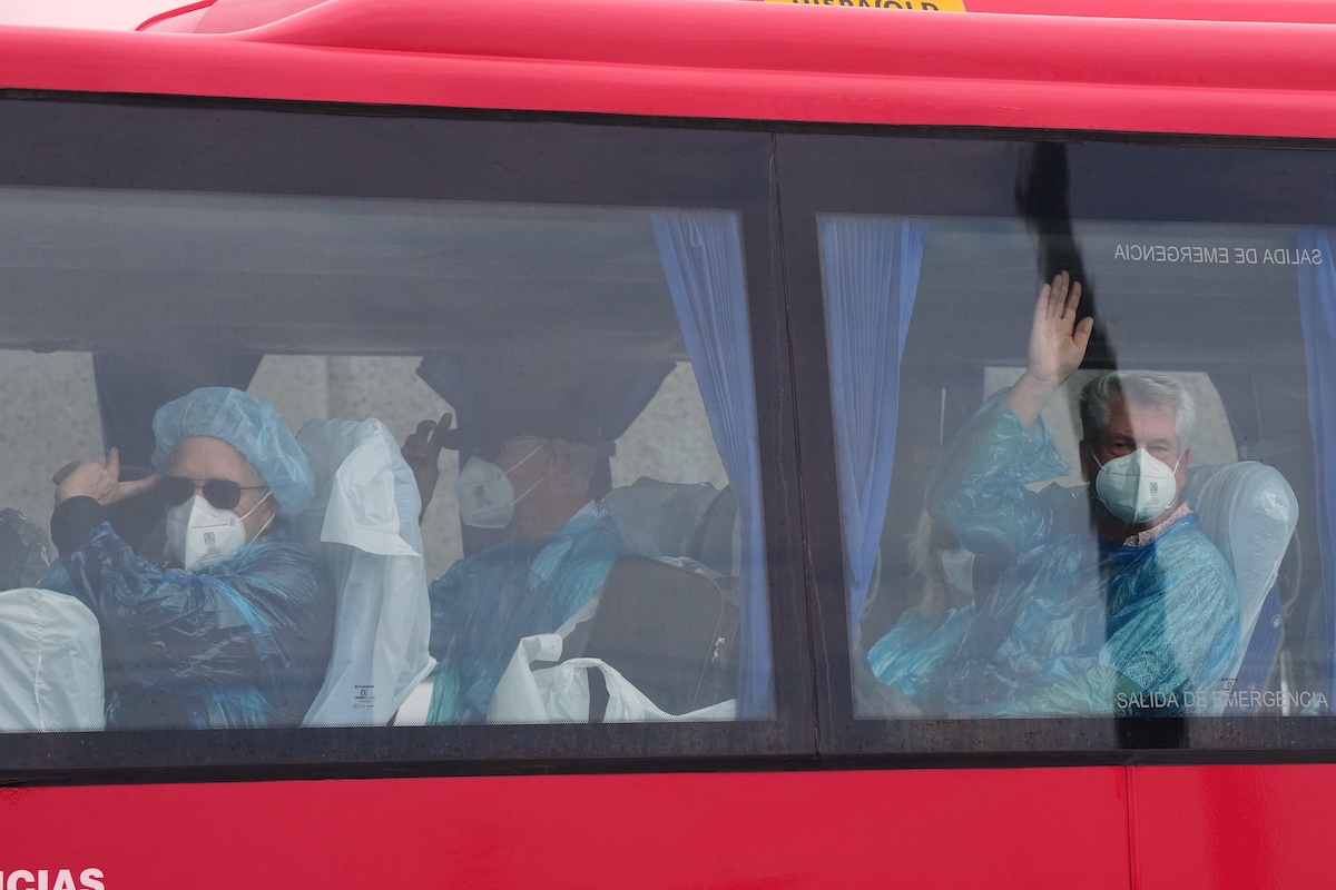 Passengers on bus after disembarking from hantavirus cruise ship 5-10-2026