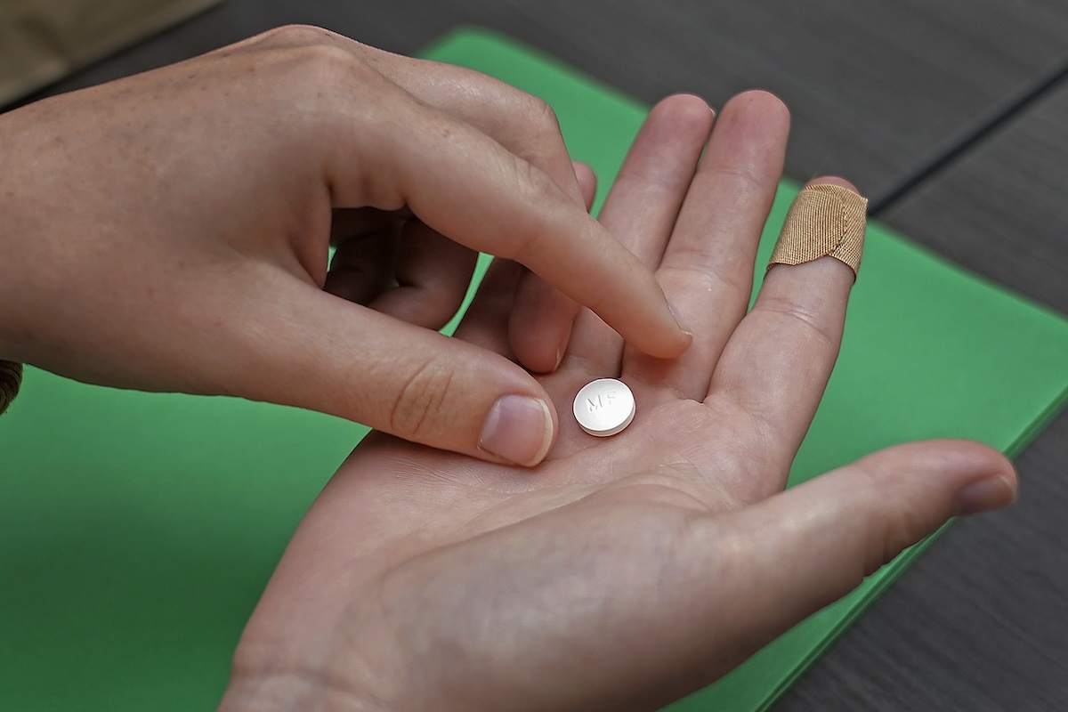 Patient prepares to take mifepristone 10-12-2022