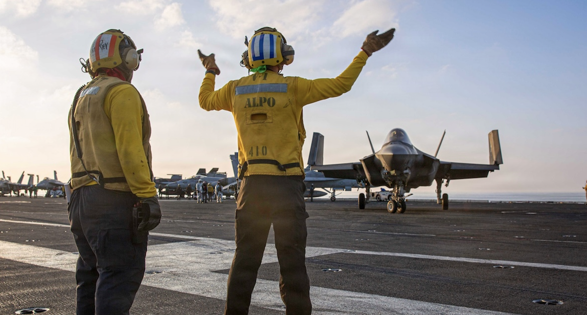 Navy sailors on carrier deck March 2026